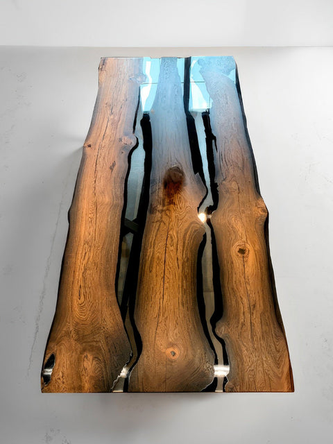 Ancient bog oak table with transparent glossy epoxy resin Echo