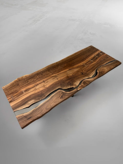 Epoxy table made of a walnut slab with butterfly details Serenity