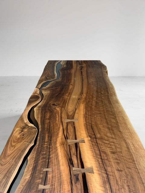Epoxy table made of a walnut slab with butterfly details Serenity