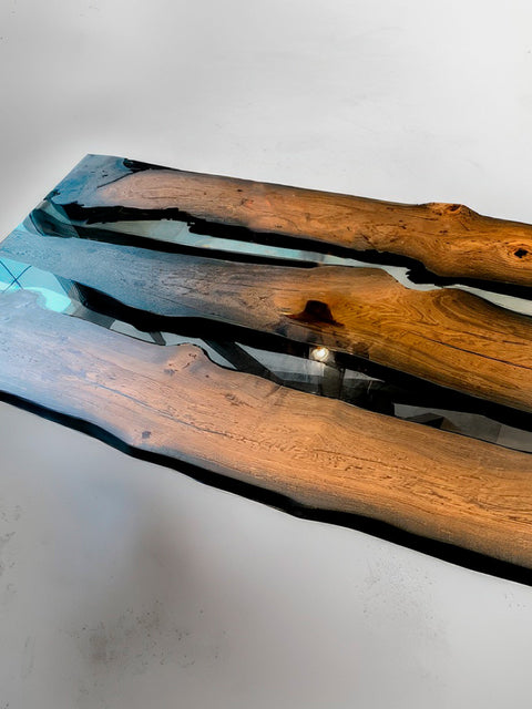 Ancient bog oak table with transparent glossy epoxy resin Echo